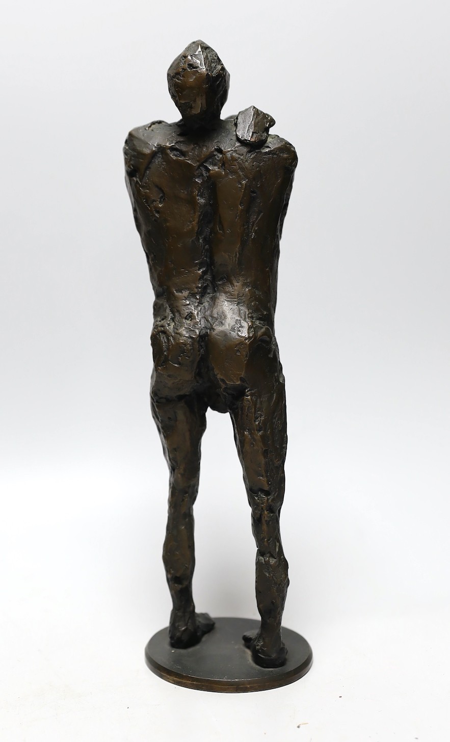 Bronze: pressed mark stamped to right ankle, one of nine, a figural male nude bronze, 35cms high